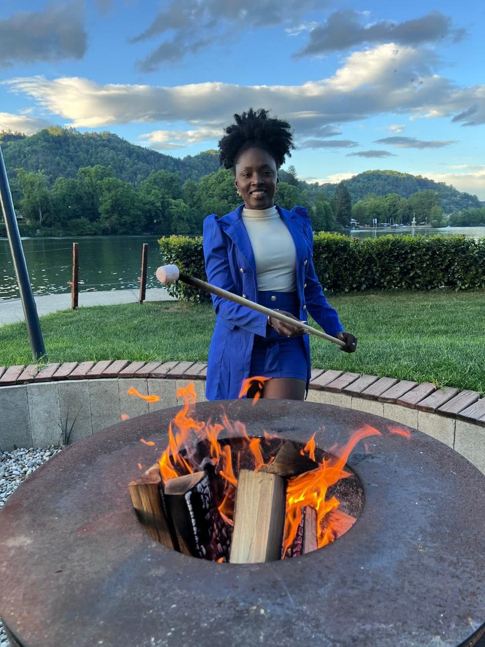 Yina Riascos in Slovenia — sunset firepit by the lake